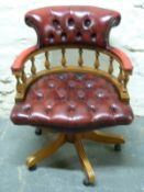 A leather Chesterfield captain's swivel chair