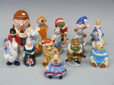 A collection of Wade Storybook figures including Pixie, Alice, Tetley Tea money box,