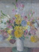 An oil on board still life of flowers in an ornate gilt frame,