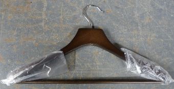 Approximately 70 quality walnut finish clothes hangers (new in boxes) with anti slip shoulder and