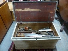 A 19thC stained / painted pine chest containing a variety of tools and collectables including cut