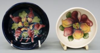 Two Moorcroft pin dishes decorated with freesias and orchids,