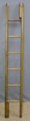 A reproduction leather and pine folding stagecoach ladder,