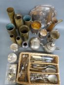 A collection of military brass shell cases, regimental buttons,