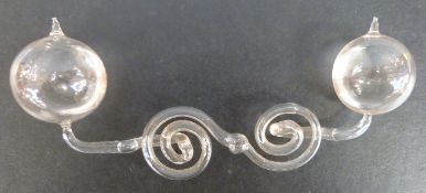 A glass Geissler electrical glow discharge tube