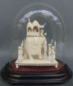 A 19thC carved ivory elephant in ceremonial dress with howdah and figures in attendance,