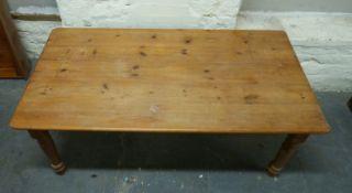 A pine table and four chairs,