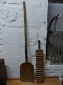 A 19thC elm shovel and a wooden wash board