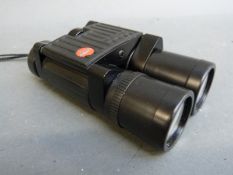 A pair of Leica Trinovid 10 x 25 binoculars in soft pouch