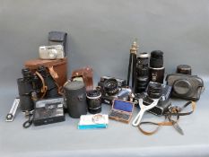 A quantity of cameras and lenses to include Zenit E, Practica Super TL, Hanimex 1:4.