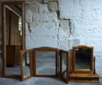 A large pine mirror and two dressing table mirrors,