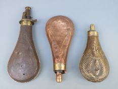 Three copper and brass power flasks, one Sykes patent and two with embossed decoration,