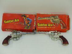 A pair of Frontier Ace cap guns in original boxes.