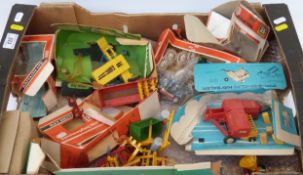 A collection of Britains model farm implements and accessories together with various empty boxes