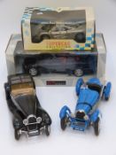 Four large scale diecast model vehicles comprising UT Models BMW M3, Maisto McLaren F1,