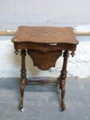 A 19thC burr walnut sewing or work table with quarter veneered and inlaid decoration,