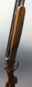 Pioneer 12 bore over and under shotgun with engraved locks, top lever, underside and trigger guard,