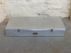 A large aluminium trunk or case with relief decoration of a rose