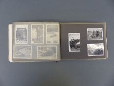 A WWII Nazi German Luftwaffe photograph album including group photo, vehicles, shot down aircraft,
