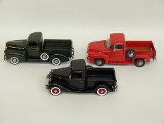 Three Danbury Mint diecast model Ford Pickup Trucks 1935, 1942 and 1956 F-100,