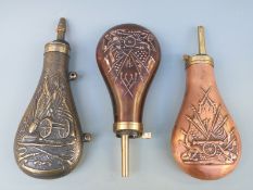 Three copper and brass powder flasks all with embossed American Civil War style regalia,