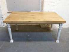 A two plank oak table on painted base,