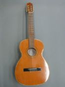 A 1980's Spanish classical guitar by Jose Ramirez with label to the interior and retailer's label