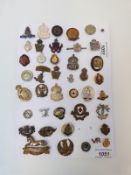 A collection of military badges including sweetheart, Home Guard,