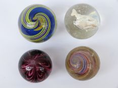 Four large handmade glass marbles including a fox Sulphide cameo example,