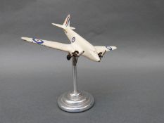 A model Airspeed Envoy aeroplane an chrome base,