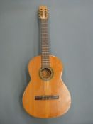 Spanish acoustic guitar by BM, fitted with six nylon strings,