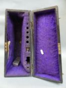 A vintage wooden cornet case