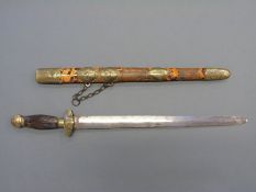 A 19thC Chinese brass mounted short sword with striated horn handle,