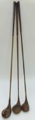 Three golf clubs,