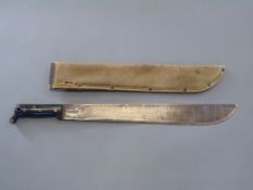 An American machete with canvas sheath,