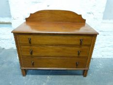 An Edwardian inlaid dressing chest of three graduated drawers,
