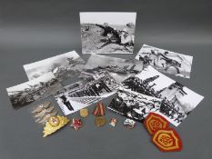 A quantity of Russian military badges and militaria including tank badges