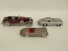 Three Franklin and Danbury Mint diecast model vehicles comprising 1949 Jaguar XK120,