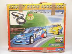 Two Scalextric style model racing sets, Nikko Circuit Radio Command and SCX RAC Rally,