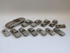 Thirteen Danbury Mint pewter model cars including an E-type Jaguar etc
