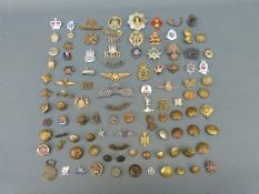 A quantity of military badges and insignia including County of London Cyclists 25,