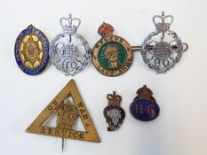 WWI On War Service badge numbered 153497, two GCHQ police badges, Women's Land Army,