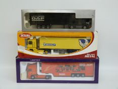 Three 1:50 scale diecast model lorries comprising Joal Renault Magnum with Komatsu Trailer,
