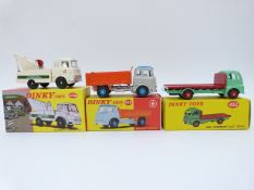 Three Atlas Editions Dinky Toys diecast model commercial vehicles comprising Guy Flat Truck 432,