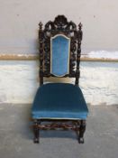 A mid to late Victorian carved nursing / hall chair