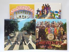 Four The Beatles albums all in at least excellent condition, comprising Sgt.