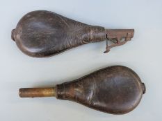 Sykes leather and brass shot flask with embossed hunting decoration and another similar both with