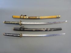 A pair of Japanese Samurai swords with decorative fittings, faux shagreen handles and 70cm blades,
