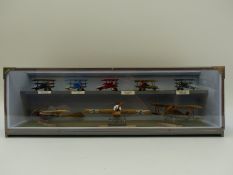 Eight scratch built model aeroplanes and bi-planes in wood and perspex display case,