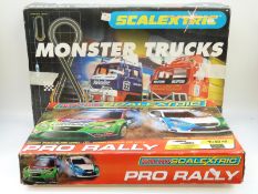 Two Scalextric model racing sets, Monster Trucks C1024 and Micro Scalextric Pro Rally G1055,